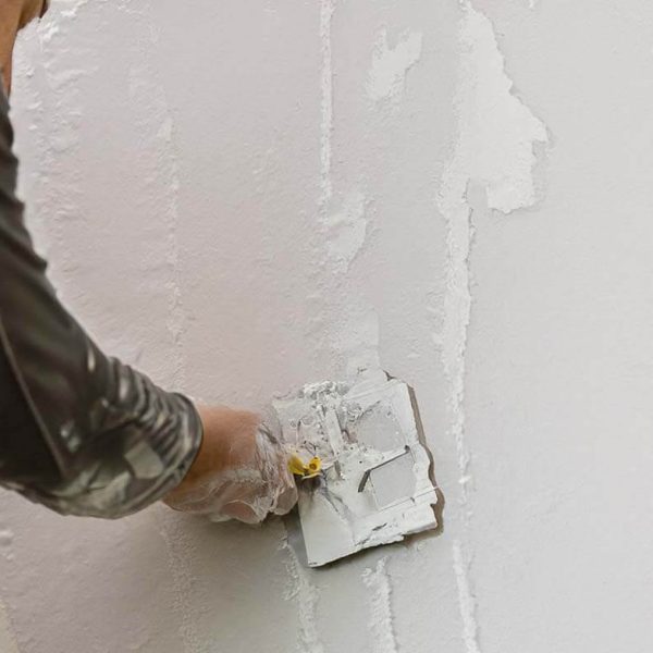 a person doing Drywall Finishing